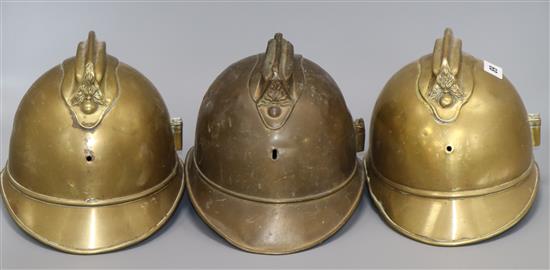 Three French fire helmets 20cm high